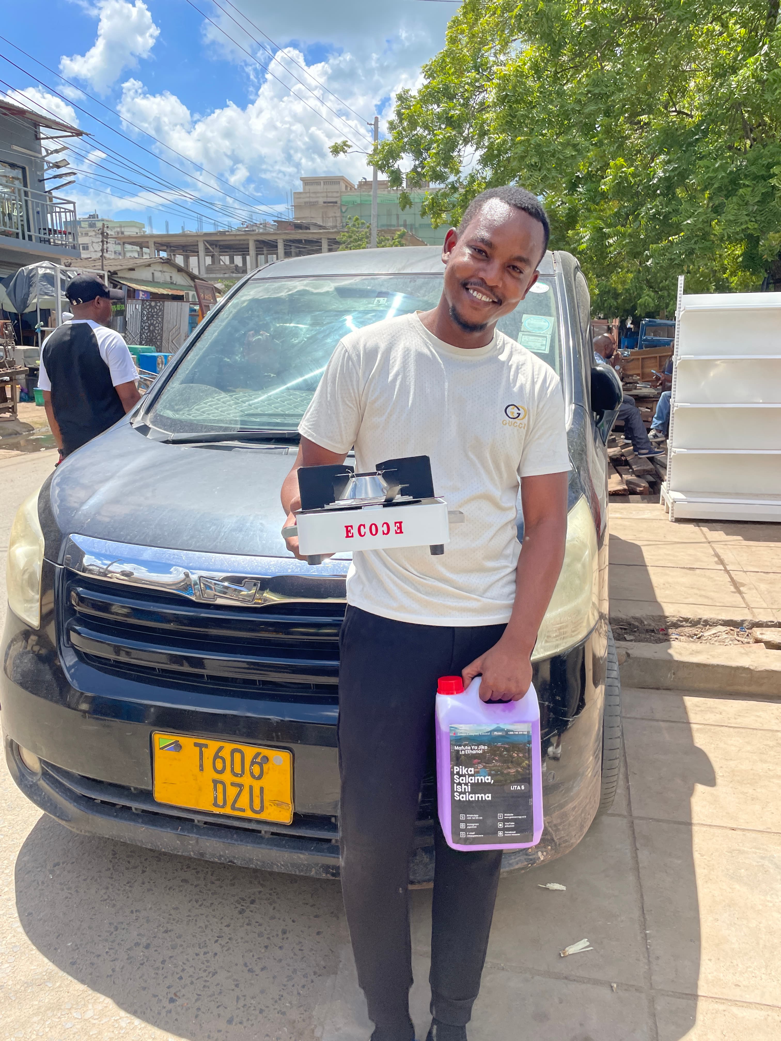 Another Gastro customer holding a bottle of ethanol cooking fuel and a portable ethanol stove